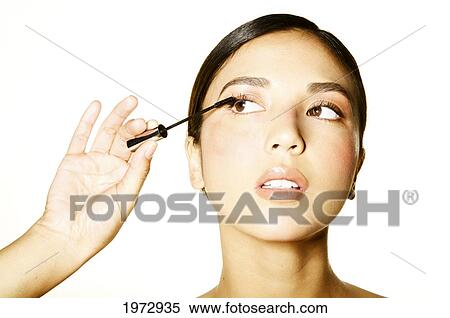 Hawaii, Studio Headshot Of A Beautiful Girl Putting On Mascara. View Large Photo Image Stock Photography - Hawaii, Studio Headshot Of A Beautiful Girl Putting On Mascara.. Fotosearch