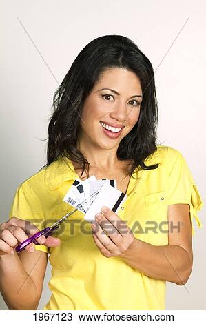 Hawaii, Studio Shot Of Woman Cutting Up Credit Cards. View Large Photo Image Stock Image - Hawaii, Studio Shot Of Woman Cutting Up Credit Cards.. Fotosearch