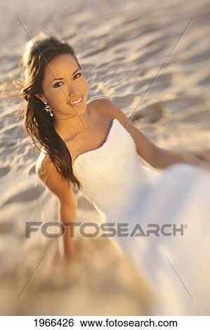 Stock Photograph - Hawaii, Stunning Bride On Beach.. Fotosearch