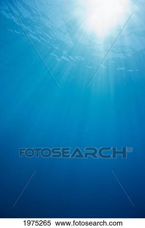 Stock Photography - Hawaii, Sunburst In Clear Blue Water.. Fotosearch