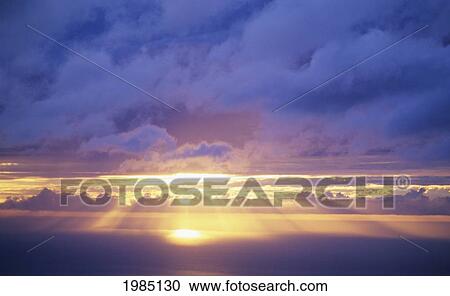 Hawaii, Sunset Over Ocean, Sunrays Bursting Through Cumulous Clouds. View Large Photo Image Stock Image - Hawaii, Sunset Over Ocean, Sunrays Bursting Through Cumulous Clouds.. Fotosearch