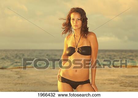 Stock Image - Hawaii, Swimsuit Model On Beach, Sunset Light.. Fotosearch