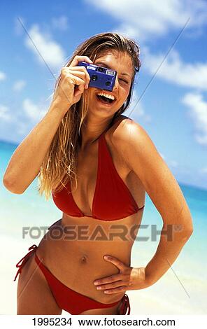 Hawaii, Teen Girl Posing With A Camera Having Fun Taking Pictures At The Beach. View Large Photo Image Picture - Hawaii, Teen Girl Posing With A Camera Having Fun Taking Pictures At The Beach.. Fotosearch