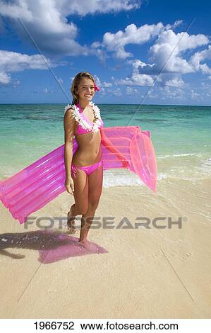 Hawaii, Teenage Girl On Beach With Inflatable. View Large Photo Image Stock Image - Hawaii, Teenage Girl On Beach With Inflatable.. Fotosearch