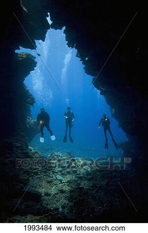 Hawaii, Three Divers With Flashlights, Pictured At A Cavern Entrance. View Large Photo Image Picture - Hawaii, Three Divers With Flashlights, Pictured At A Cavern Entrance.. Fotosearch