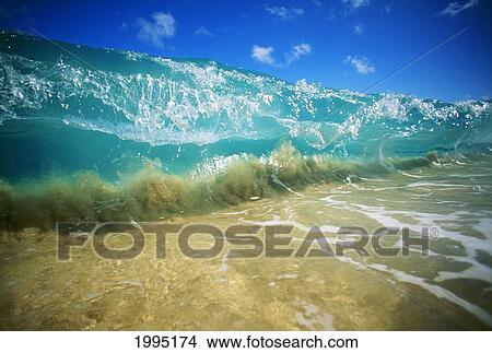 Hawaii, Turquoise Breaking Wave, Sand Visible Through Clear Water, Blue Sky. Close-Up. View Large Photo Image Picture - Hawaii, Turquoise Breaking Wave, Sand Visible Through Clear Water, Blue Sky. Close-Up.. Fotosearch