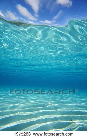 Stock Image - Hawaii, Turquoise Water Shimmering In The Sunlight.. Fotosearch