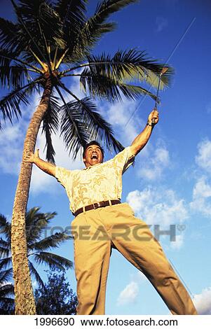 Hawaii, Upward Angle, Golfer Overjoyed Jump. Blue Sky And Palm Tree Background. View Large Photo Image Stock Image - Hawaii, Upward Angle, Golfer Overjoyed Jump. Blue Sky And Palm Tree Background.. Fotosearch