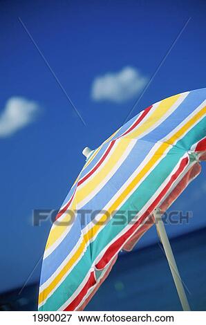 Hawaii, Upward View Of Colorful Beach Umbrella, With Sky In Background View Large Photo Image Stock Photo - Hawaii, Upward View Of Colorful Beach Umbrella, With Sky In Background. Fotosearch