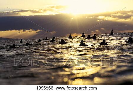 Stock Photograph - Hawaii, View Of Surfers In Ocean At Sunset, Silhouette. Fotosearch