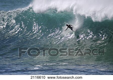 Hawaii, Waimea Bay, man surfing a large wave. View Large Photo Image Stock Image - Hawaii, Waimea Bay, man surfing a large wave.. Fotosearch