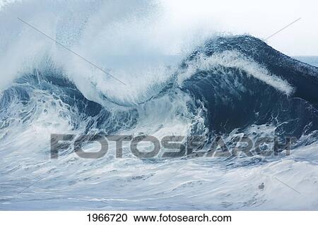 Stock Image - Hawaii, Wave Breaking In Hawaii.. Fotosearch