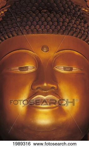 Stock Photograph - Hawaii, Windward Oahu, Valley Of The Temples, Byodo Inn, Close-Up Of Buddha Statue.. Fotosearch