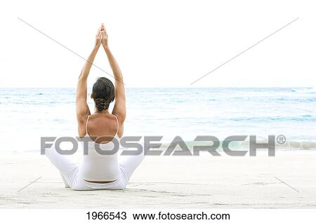 Hawaii, Woman Meditating On Ocean Shore. View Large Photo Image Stock Image - Hawaii, Woman Meditating On Ocean Shore.. Fotosearch