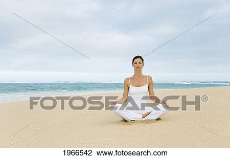 Hawaii, Woman Meditating On Quiet Beach. View Large Photo Image Stock Image - Hawaii, Woman Meditating On Quiet Beach.. Fotosearch