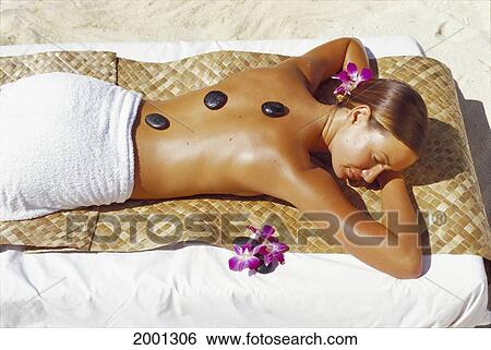 Hawaii, Woman Receives Spa Treatment On Lauhala Mat, Smooth River Rocks Atop Back Orchid Flowers Sand Beach D1193 View Large Photo Image Stock Photograph - Hawaii, Woman Receives Spa Treatment On Lauhala Mat, Smooth River Rocks Atop Back Orchid Flowers Sand Beach D1193. Fotosearch