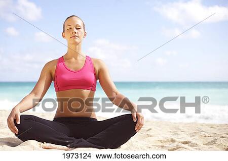 Picture - Hawaii, Woman Sitting On Beach In Remote Tropical Location.. Fotosearch