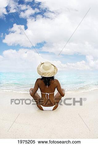 Hawaii, Woman Sitting On Beach In Remote Tropical Location. View Large Photo Image Stock Photography - Hawaii, Woman Sitting On Beach In Remote Tropical Location.. Fotosearch