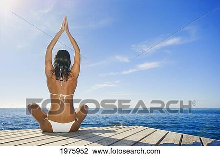 Hawaii, Woman Sitting On Dock In Remote Location. View Large Photo Image Stock Image - Hawaii, Woman Sitting On Dock In Remote Location.. Fotosearch