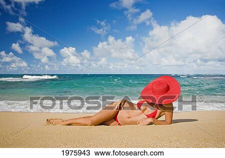 Hawaii, Woman Sitting On The Beach At A Remote Tropical Location. View Large Photo Image Stock Image - Hawaii, Woman Sitting On The Beach At A Remote Tropical Location.. Fotosearch