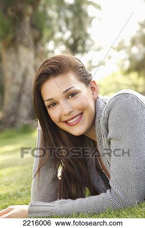 Hawaii, Woman smiles for an outdoor portrait in the park. View Large Photo Image Stock Photograph - Hawaii, Woman smiles for an outdoor portrait in the park.. Fotosearch