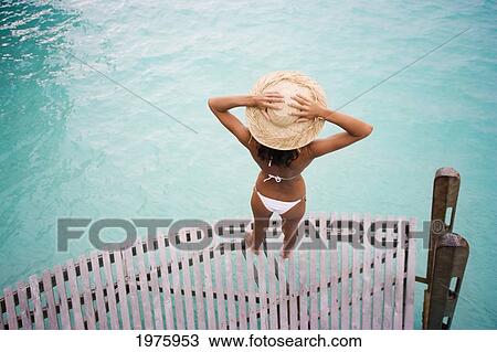 Hawaii, Woman Standing On Dock. View Large Photo Image Stock Image - Hawaii, Woman Standing On Dock.. Fotosearch