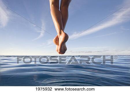 Hawaii, Womans Legs Hanging From Dock. View Large Photo Image Stock Image - Hawaii, Womans Legs Hanging From Dock.. Fotosearch