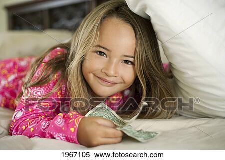 Hawaii, Young Girl Collecting Tooth Fairy Money From Under Pillow. View Large Photo Image Stock Photography - Hawaii, Young Girl Collecting Tooth Fairy Money From Under Pillow.. Fotosearch