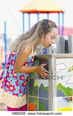 Hawaii, Young Girl Taking A Drink From A Park Water Fountain. View Large Photo Image Stock Photography - Hawaii, Young Girl Taking A Drink From A Park Water Fountain.. Fotosearch