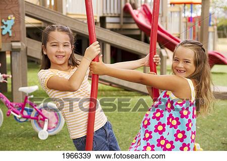 Stock Photo - Hawaii, Young Girls Enjoying A Day At The Park.. Fotosearch