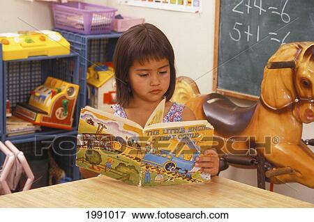 Stock Photo - Hawaii, Young Local Girl Learning To Read. Fotosearch