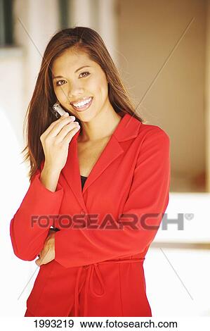 Hawaiian Businesswoman Outdoors On Cellphone, Bright Red Business Suit View Large Photo Image Stock Photo - Hawaiian Businesswoman Outdoors On Cellphone, Bright Red Business Suit. Fotosearch