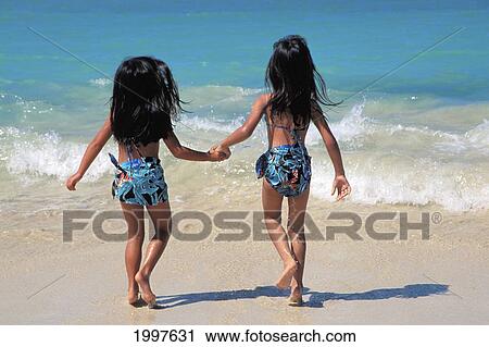 Hawaiian Girls Running Into Shoreline, View From Behind, Matching Outfits View Large Photo Image Stock Image - Hawaiian Girls Running Into Shoreline, View From Behind, Matching Outfits. Fotosearch