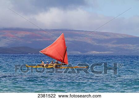Stock Image - Hawaiian sailing canoe off Maui's south shore; Makena, Maui, Hawaii, United States of America. Fotosearch