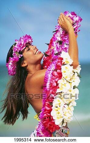 Hawaiian Woman Wearing Haku And Holding Leis On Beach. View Large Photo Image Picture - Hawaiian Woman Wearing Haku And Holding Leis On Beach.. Fotosearch