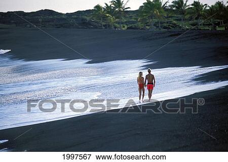 Hawaiibig Island, Couple Walk On Black Sand Beach View Large Photo Image Stock Photo - Hawaiibig Island, Couple Walk On Black Sand Beach. Fotosearch