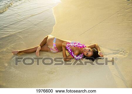 Stock Image - Hawii, Attractive Girl In The Beautiful Sunset Light At The Beach.. Fotosearch