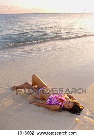 Hawii, Attractive Girl In The Beautiful Sunset Light At The Beach. View Large Photo Image Stock Image - Hawii, Attractive Girl In The Beautiful Sunset Light At The Beach.. Fotosearch