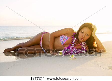 Stock Image - Hawii, Lanikai, Attractive Girl In The Beautiful Sunset Light At The Beach.. Fotosearch