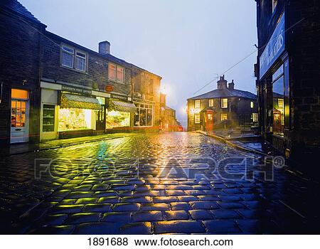 Stock Photo - Haworth Main Street Illuminated At Dusk. Fotosearch