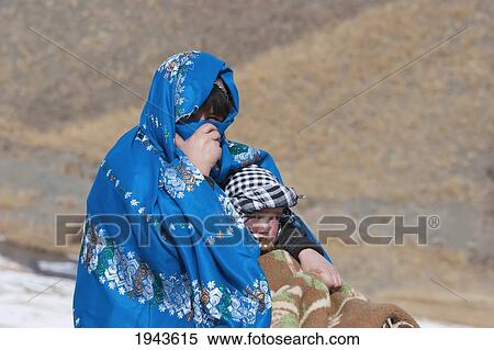 Stock Photography - Hazara Woman And Boy In The Hajigak Pass, Vardak Province, Afghanistan. Fotosearch