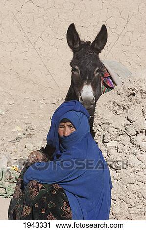 Hazara Woman And Donkey In Bamiyan, Bamian Province, Afghanistan View Large Photo Image Stock Image - Hazara Woman And Donkey In Bamiyan, Bamian Province, Afghanistan. Fotosearch