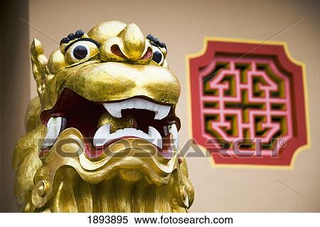 Stock Photography - Head Of Golden Lion Protector At Entrance To Sam Poh Temple. Fotosearch