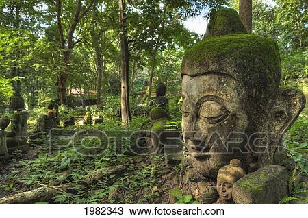 Stock Image - Head Statues In Wat Umong A Famous Forest Temple; Chiang Mai Thailand. Fotosearch