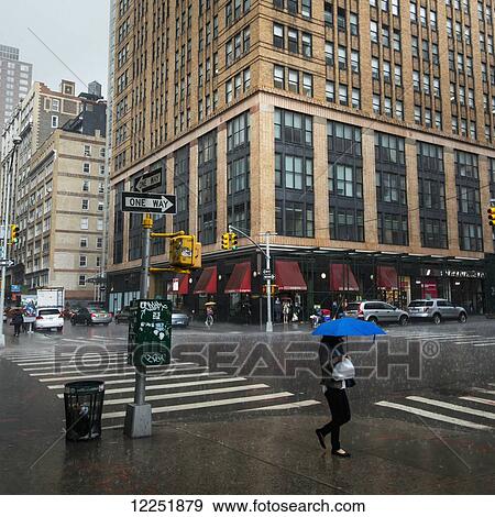 Stock Photo - Heavy rainfall in a busy New York City street; New York City, New York, United States of America. Fotosearch