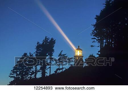 Heceta Head lighthouse shining through the oncoming darkness; Oregon, United States of America View Large Photo Image Stock Image - Heceta Head lighthouse shining through the oncoming darkness; Oregon, United States of America. Fotosearch