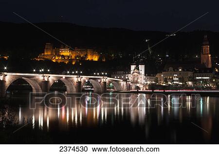 Heidelberg Castle and the old bridge over River Neckar illuminated at nighttime; Heidelberg, Germany View Large Photo Image Stock Image - Heidelberg Castle and the old bridge over River Neckar illuminated at nighttime; Heidelberg, Germany. Fotosearch