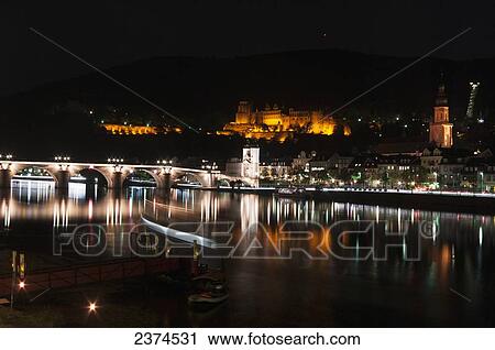 Heidelberg Castle and the old bridge over River Neckar illuminated at nighttime; Heidelberg, Germany View Large Photo Image Stock Image - Heidelberg Castle and the old bridge over River Neckar illuminated at nighttime; Heidelberg, Germany. Fotosearch