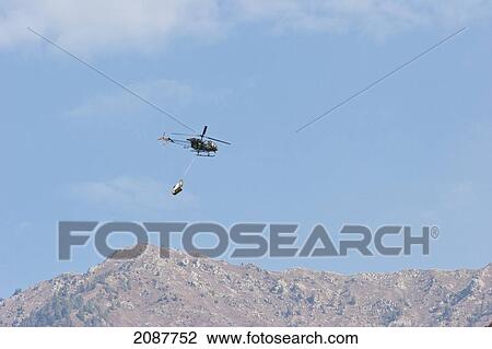 Helicopter Hovering Above Chinari, Azad Kashmir, Pakistan View Large Photo Image Stock Image - Helicopter Hovering Above Chinari, Azad Kashmir, Pakistan. Fotosearch