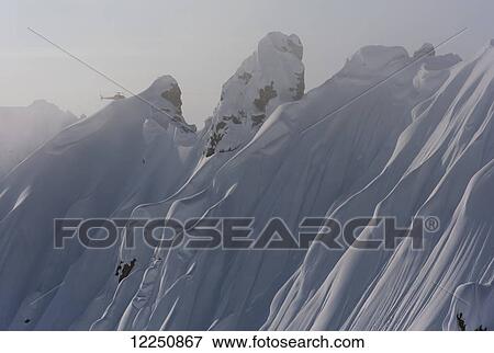 Helicopter tour over mountain peaks; Haines, Alaska, United States of America View Large Photo Image Stock Photo - Helicopter tour over mountain peaks; Haines, Alaska, United States of America. Fotosearch